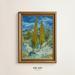 May include: A framed art print of a landscape painting. The artwork depicts two tall, yellow-green trees against a blue sky with swirling clouds. The print has a gold-coloured frame and the text "KOI ART PRINTS" at the bottom.