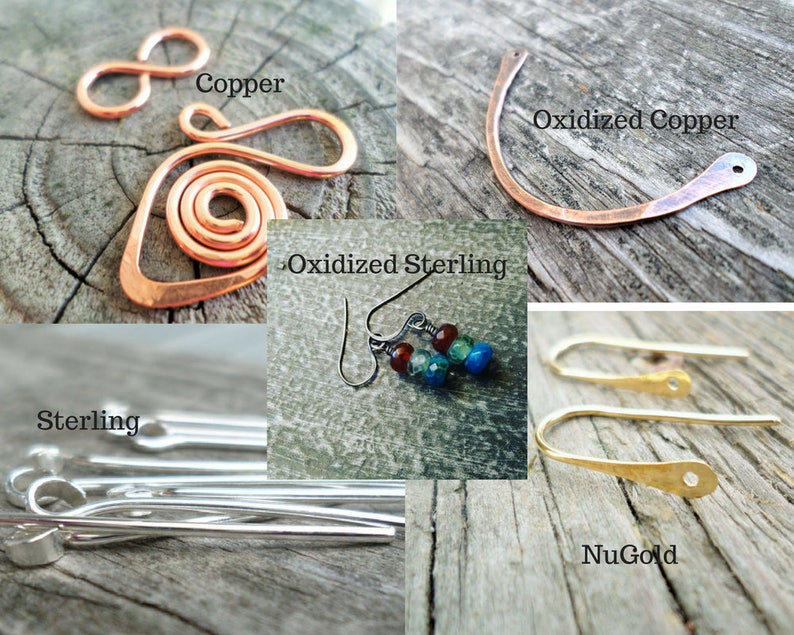 May include: Four different types of earring wires: copper, oxidized copper, sterling silver, and NuGold. The copper wires are in the shape of an infinity symbol and a spiral. The oxidized copper wire is a simple curved shape. The sterling silver wires are straight and have a loop at one end. The NuGold wires are curved and have a small hole at one end.