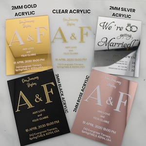 May include: Five acrylic wedding invitations with different colors and finishes. The invitations feature the text "Our Journey Begins" and the initials "A&F" in gold lettering. The invitations also include the names "Amy Love and Felix Clarke" and the date "19 April 2030 19:00 PM".