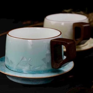 Handmade Ceramic Coffee Cup with Wooden Handle and Matching Saucer – Elegant Tea Mug Set, Artisan Pottery Drinkware, Gift for Coffee Lovers