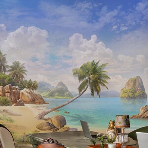 May include: A wall mural depicting a tropical beach scene with palm trees, large rocks, and turquoise water, installed in a room with a white paneled door, two wooden chairs with striped upholstery, and a desk holding a laptop and a lamp.