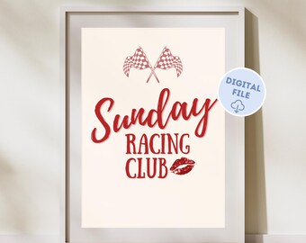 Op de afbeelding: Een wit ingelijst print met een rood geruit vlagontwerp en de tekst "Sunday Racing Club" met een rode lippenstiftkus.