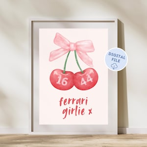 Puede incluir: Un imprimible digital con dos cerezas rojas con los números 16 y 44 en ellas. Las cerezas están atadas con un lazo rosa. El texto "ferrari girlie x" está debajo de las cerezas.