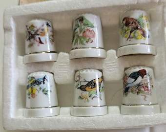 Set of 6 Vintage Porcelain Thimbles with bird motif.