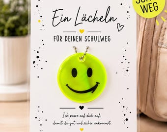 Reflektor Anhänger für Schulranzen – Ein Lächeln für deinen Schulweg | Geschenk für Grundschulkind im Herbst und Winter