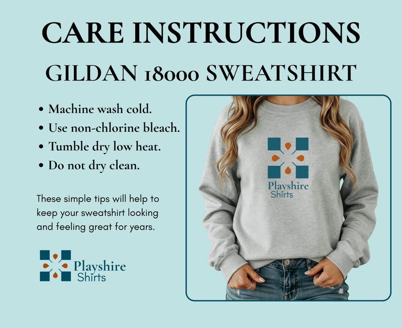 May include: A light gray crewneck sweatshirt featuring a blue and orange geometric logo with the text Playshire Shirts. The image includes care instructions for a Gildan 18000 sweatshirt, listing machine wash cold, non-chlorine bleach, and tumble dry low.