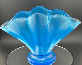 A 1920s Fenton Celeste Blue iridescent stretch glass fan vase with a ruffled rim.