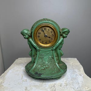 Unique vintage Lux cherub clock.