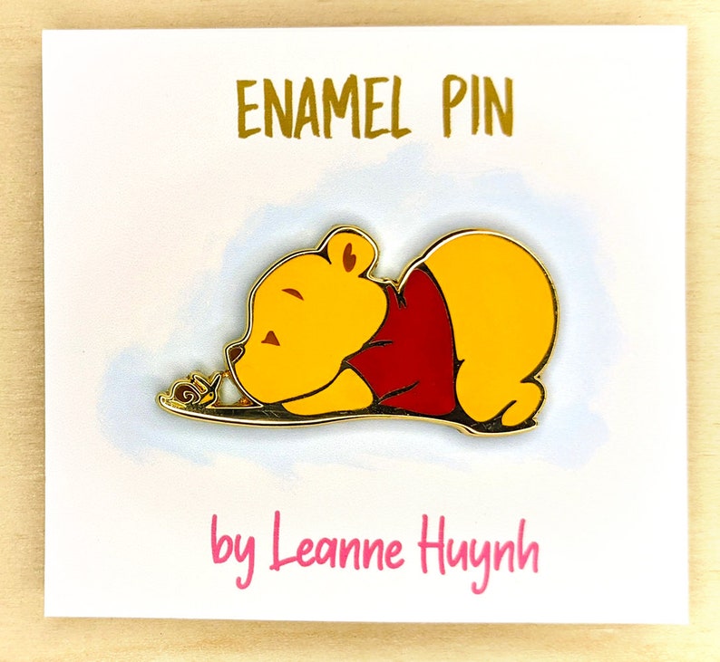 Baby Winnie the Pooh Bear with Snail Gold Enamel Pin image 1