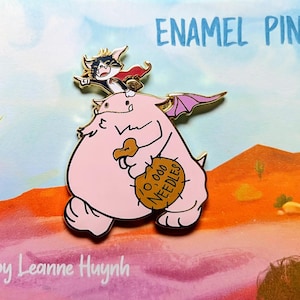 May include: Enamel pin featuring a cartoon pig with bat wings carrying a bag labeled "10,000 Needles." A cat with a cape rides on the pig's back. The pin has gold accents and the words "ENAMEL PIN" are at the top.