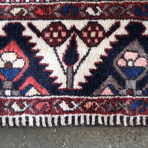 a close-up view of a colorful, intricately patterned rug with a floral design.