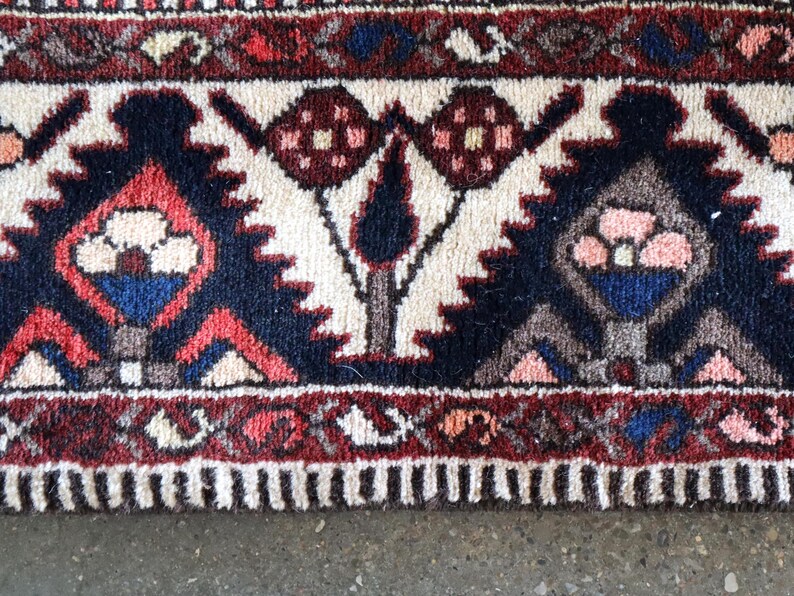 a close-up view of a colorful, intricately patterned rug with a floral design.