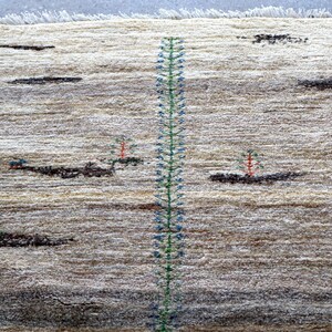 a rug with a tall green plant design running vertically down the center.