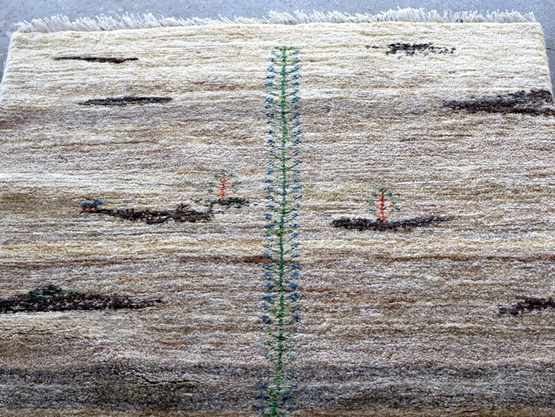 a rug with a tall green plant design running vertically down the center.