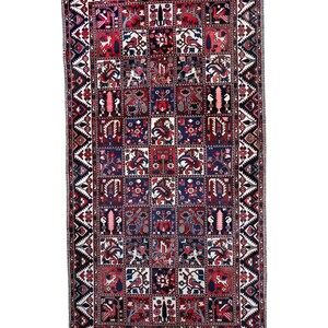 a large, intricately designed rug with a variety of patterns and colors.