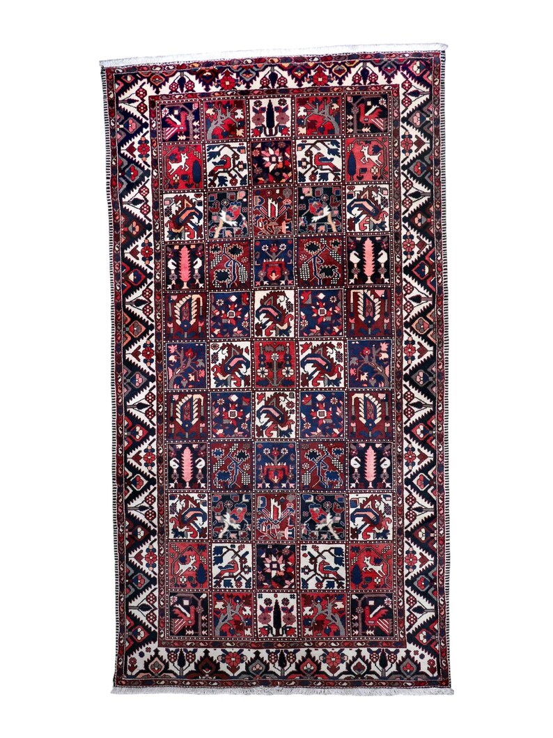 a large, intricately designed rug with a variety of patterns and colors.
