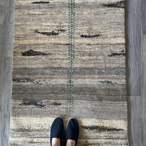 Cream and Gray Plush Wool Accent Rug.