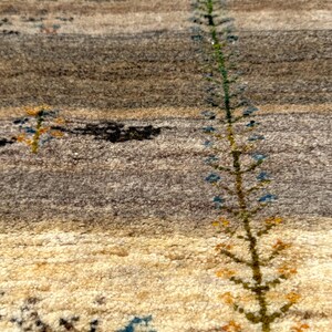 a long, thin plant with green leaves and small flowers, growing out of a carpeted surface.