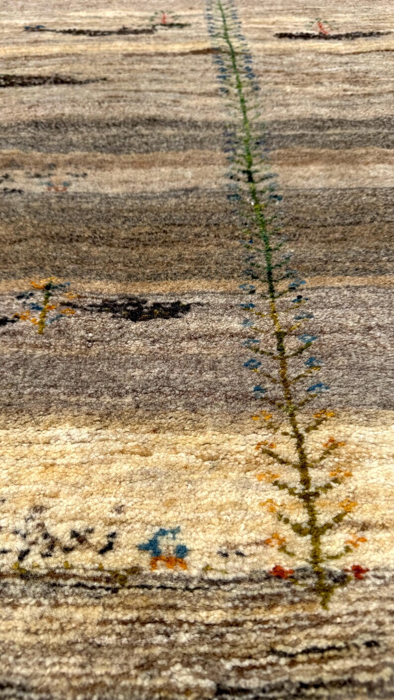 a long, thin plant with green leaves and small flowers, growing out of a carpeted surface.