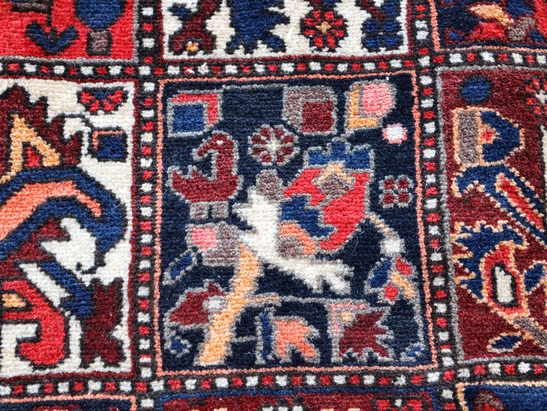 The image is a close-up of a colorful, intricately designed rug with various patterns and shapes.