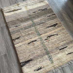 Cream and Gray Plush Wool Accent Rug.