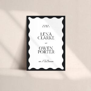 Studio hero with soft shadows highlighting the minimal wavy border welcome sign; monochrome palette; template suited to modern, elegant or minimalist wedding styles; printable straight-edge finish.