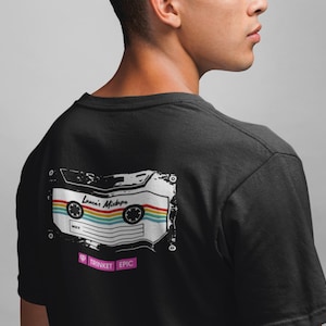 May include: A set of three ceramic mugs with a speckled, matte finish. The mugs are in shades of cream, light gray, and dark gray. Each mug has a simple, minimalist design and a rounded handle.