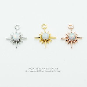 May include: Three North Star pendants, each featuring a central round opal-like stone and radiating metal points. The set includes one silver-tone, one gold-tone, and one rose gold-tone pendant. Each piece measures approximately 9x11mm including the loop.