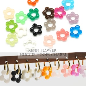 Puede incluir: Surtido de abalorios de resina con forma de flor en varios colores, incluyendo rosa, azul, verde, naranja y negro. Los abalorios tienen forma de flor con un agujero en el centro, perfectos para añadir a joyas o manualidades.