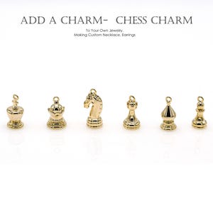 May include: Gold chess piece charms, including a king, queen, bishop, knight, and pawn. These charms can be added to necklaces, bracelets, or earrings.