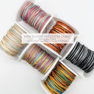 May include: Spools of 1mm waxed polyester cord in various colors, including rainbow mixes, are displayed. The text on the image reads "1MM WAXED POLYESTER CORD Rainbow Mixed Colors 3Ply Twisted Cord, Artisan String for Making Necklace Bracelet".