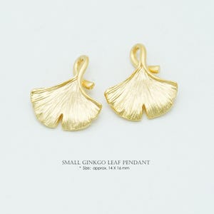 May include: A set of three ceramic mugs with a speckled, matte finish. The mugs are in shades of cream, light brown, and dark brown. Each mug has a simple, minimalist design and a rounded handle.