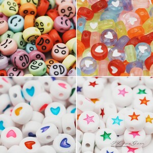 May include: Assortment of colorful plastic beads with different designs. The beads are round and have a hole in the center. Some beads have smiley faces, hearts, and stars.