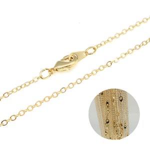 May include: A gold chain necklace with a lobster clasp closure. The chain is made of small, round links.