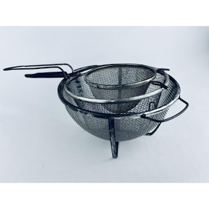 May include: A handmade wooden sign with the text "Welcome" in a whimsical font. The sign is painted white with a distressed finish, and features a decorative floral design in shades of pink and green. It measures approximately 12 inches wide.