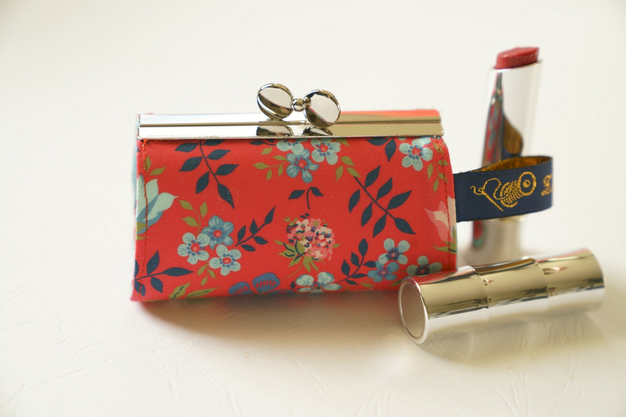 Lipstick Case/ Lipbalm case/ silver metal frame/ Liberty cotton/delicate flowers on a red background