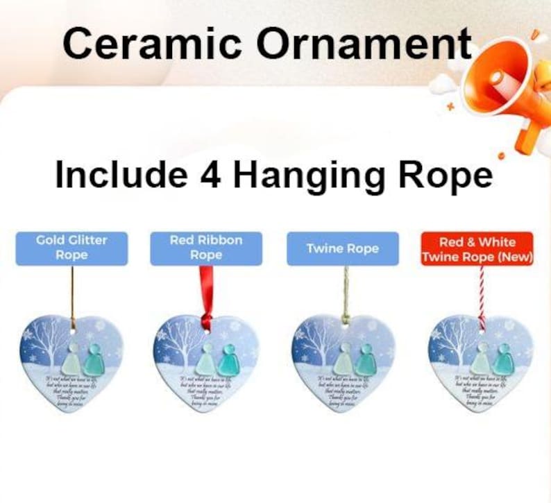 May include: Ceramic heart-shaped ornament with a winter scene and the text "It's not what we have in life that matters, but who we have in our life." Includes gold glitter, red ribbon, twine, and red & white twine ropes.