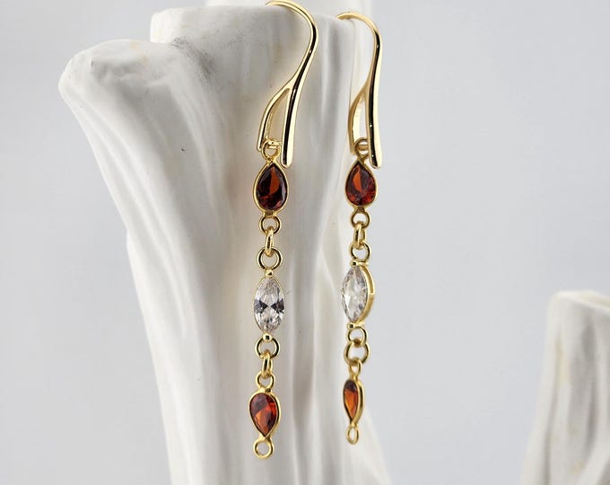 Featured listing image: Pear Cut Garnets and Crystals on Gold Earrings