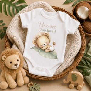 Wild One baby bodysuit mockup featuring safari nursery theme, watercolor baby lion clipart, and tropical jungle elements.