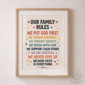 May include: A framed wall art print featuring the text OUR FAMILY RULES in black, followed by colorful lines of text including WE PUT GOD FIRST, WE CHOOSE KINDNESS, WE FORGIVE QUICKLY, WE SPEAK WITH LOVE, WE SUPPORT EACH OTHER, WE ARE GRATEFUL, WE NEVER GIVE UP, BECAUSE FAITH IS EVERYTHING.