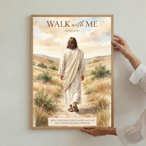 May include: A framed art print featuring a watercolor illustration of a figure in a white robe walking on a path. The text "WALK with ME" and "MOSES 6:34" are at the top. The bottom text reads "AND THOU SHALT ABIDE IN ME, AND I IN YOU; THEREFORE WALK WITH ME."