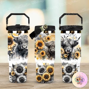 May include: Three stainless steel tumblers with a white background and a black and white highland cow with sunflowers. The tumblers have a black lid and handle.