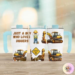 May include: A set of three white stainless steel tumblers with a blue handle. The tumblers feature a construction theme with a yellow excavator, a boy in a hard hat, and the text "Just a boy who loves diggers".