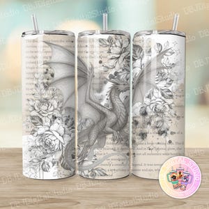 May include: Three stainless steel tumblers with straws, each decorated with a dragon and floral design in grey and white. The design includes text and is set against a vintage paper background.