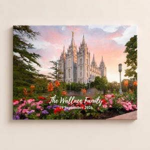 May include: A rectangular canvas print featuring a watercolor-style illustration of a large temple with multiple spires under a pink and orange sunset sky. In the foreground, vibrant pink, red, and orange flowers bloom. Text reads: The Wallace Family 19 September 2026.