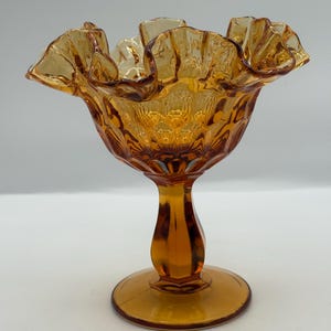 Vintage Fenton Amber Glass Compote / Candy Dish Featuring A Thumprint Design and Ruffed Edge 6” Hx 5.5” W