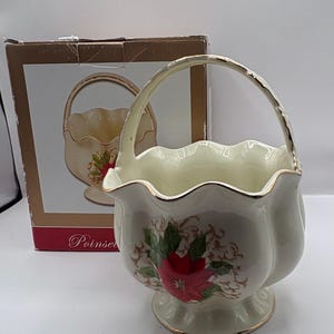Vintage porcelain basket with handle featuring a poinsettia design in original box made by Essex 8.5” H x 6”W