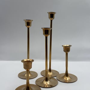 Vintage 1970 Brass Candlestick Holders set of (5) in various heights featuring a flared base Made in Taiwan Tallest 8” H smallest 3” H