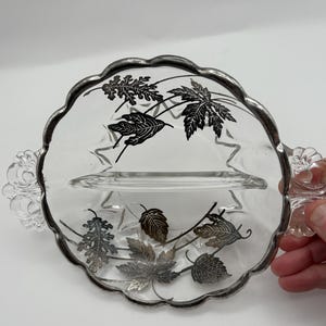 Vintage Reliah dish . Silver City Glass Co . Silver overlay featuring a Forrest pattern
