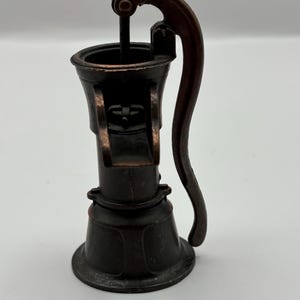 Vintage die-cast metal water well pump pencil  sharpener made in Spain great for office , collection , man cave , desk decor